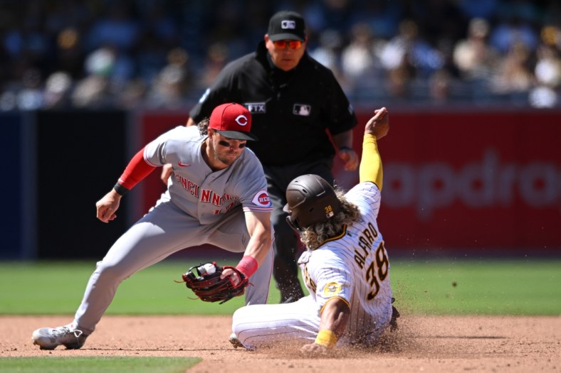 Apr 20, 2022; San Diego, California, USA; San Diego Padres catcher Jorge Alfaro (38) steals second base ahead of the tag by Cincinnati Reds shortstop Kyle Farmer (17) during the fifth inning at Petco Park. Mandatory Credit: Orlando Ramirez-USA TODAY Sports