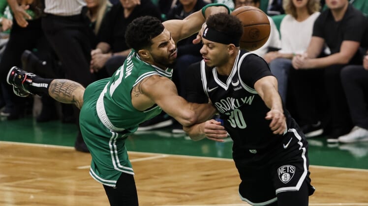 Apr 20, 2022; Boston, Massachusetts, USA; Brooklyn Nets guard Seth Curry (30) commits a flagrant foul on Boston Celtics forward Jayson Tatum (0) during the first quarter of game two of the first round for the 2022 NBA playoffs at TD Garden. Mandatory Credit: Winslow Townson-USA TODAY Sports