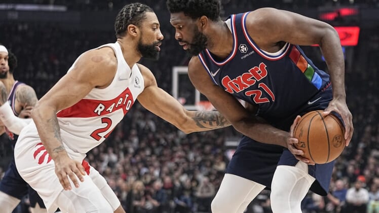 Apr 20, 2022; Toronto, Ontario, CAN; Toronto Raptors center Khem Birch (24) defends against Philadelphia 76ers center Joel Embiid (21) during the first half of game three of the first round for the 2022 NBA playoffs at Scotiabank Arena. Mandatory Credit: John E. Sokolowski-USA TODAY Sports