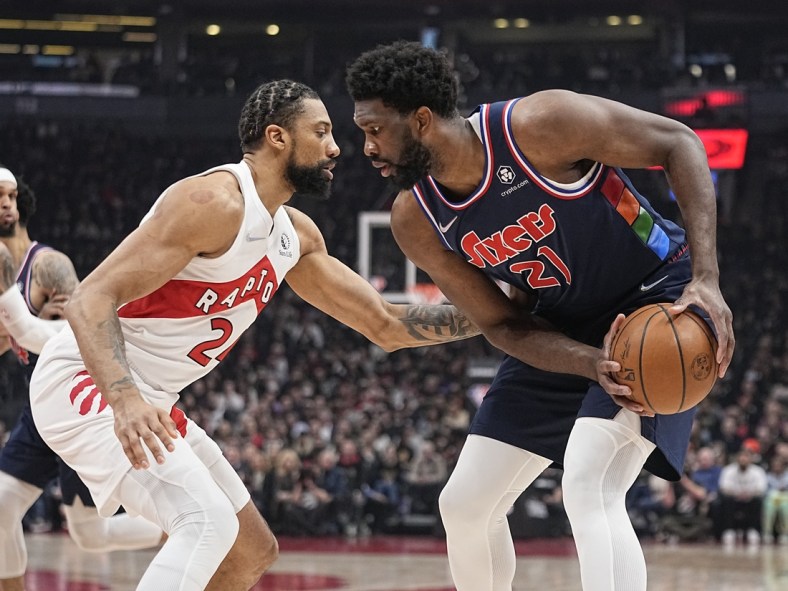Apr 20, 2022; Toronto, Ontario, CAN; Toronto Raptors center Khem Birch (24) defends against Philadelphia 76ers center Joel Embiid (21) during the first half of game three of the first round for the 2022 NBA playoffs at Scotiabank Arena. Mandatory Credit: John E. Sokolowski-USA TODAY Sports