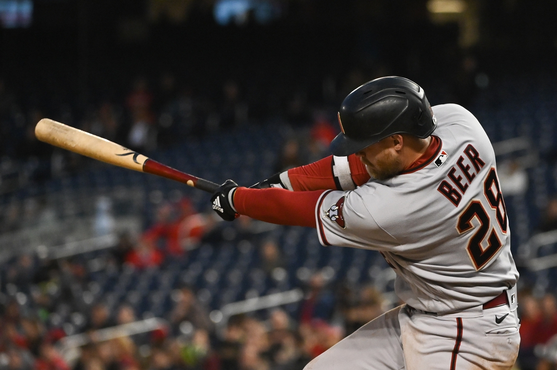 Apr 20, 2022; Washington, District of Columbia, USA;  Arizona Diamondbacks first baseman Seth Beer (28) swings through a two run single in the third inning against the Washington Nationals at Nationals Park. Mandatory Credit: Tommy Gilligan-USA TODAY Sports