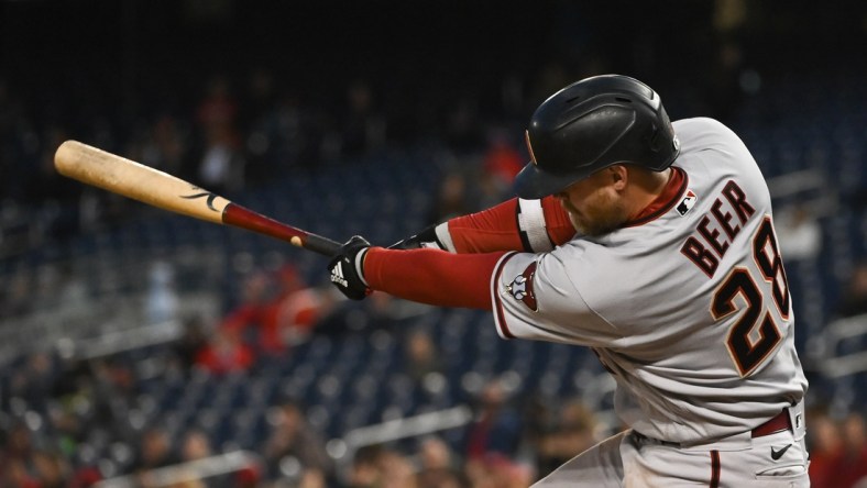 Apr 20, 2022; Washington, District of Columbia, USA;  Arizona Diamondbacks first baseman Seth Beer (28) swings through a two run single in the third inning against the Washington Nationals at Nationals Park. Mandatory Credit: Tommy Gilligan-USA TODAY Sports