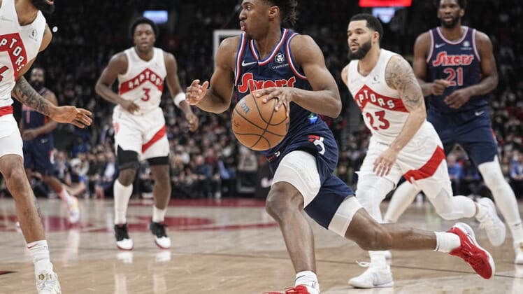 Apr 20, 2022; Toronto, Ontario, CAN; Philadelphia 76ers guard Tyrese Maxey (0) dribbles to the basket past Toronto Raptors guard Fred VanVleet (23) during the first half of game three of the first round for the 2022 NBA playoffs at Scotiabank Arena. Mandatory Credit: John E. Sokolowski-USA TODAY Sports