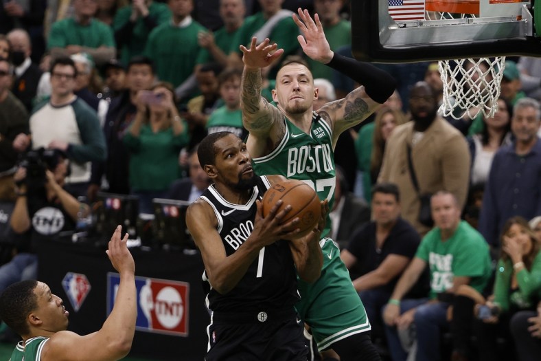 Apr 20, 2022; Boston, Massachusetts, USA; Brooklyn Nets forward Kevin Durant (7) tries to get to the basket past Boston Celtics center Daniel Theis (27) during the fourth quarter of game two of the first round of the 2022 NBA playoffs at TD Garden. Mandatory Credit: Winslow Townson-USA TODAY Sports