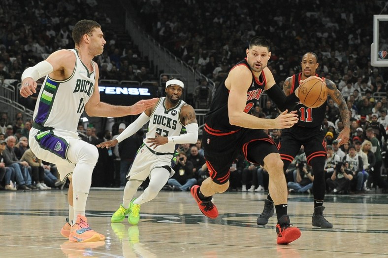 Apr 20, 2022; Milwaukee, Wisconsin, USA; Chicago Bulls guard Zach LaVine (8) drives to the basket against Milwaukee Bucks center Brook Lopez (11) in the first half during game two of the first round for the 2022 NBA playoffs at Fiserv Forum. Mandatory Credit: Michael McLoone-USA TODAY Sports