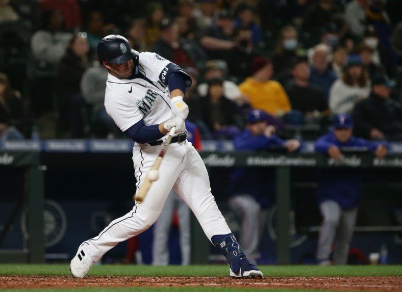 Apr 20, 2022; Seattle, Washington, USA; Seattle Mariners third baseman Ty France (23) hits an RBI single against the Texas Rangers during the fifth inning at T-Mobile Park. Mandatory Credit: Lindsey Wasson-USA TODAY Sports