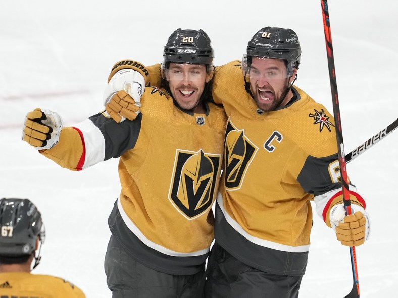 Apr 20, 2022; Las Vegas, Nevada, USA; Vegas Golden Knights center Chandler Stephenson (20) celebrates with right wing Mark Stone (61) after scoring a third period goal against the Washington Capitals at T-Mobile Arena. Mandatory Credit: Stephen R. Sylvanie-USA TODAY Sports