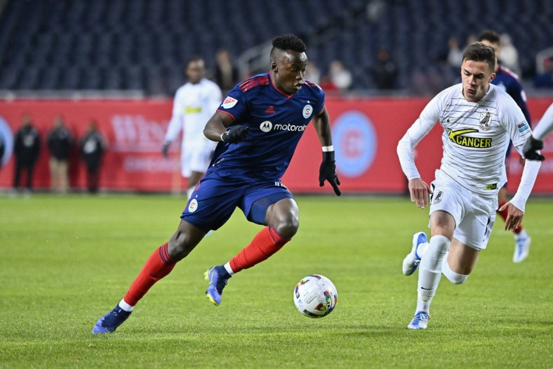 Apr 19, 2022; Chicago, Illinois, USA;  Chicago Fire FC defender Jhon Espinoza (14) controls the ball against Union Omaha at Soldier Field. Union Omaha defeated Chicago Fire FC on penalty kicks. Mandatory Credit: Jamie Sabau-USA TODAY Sports