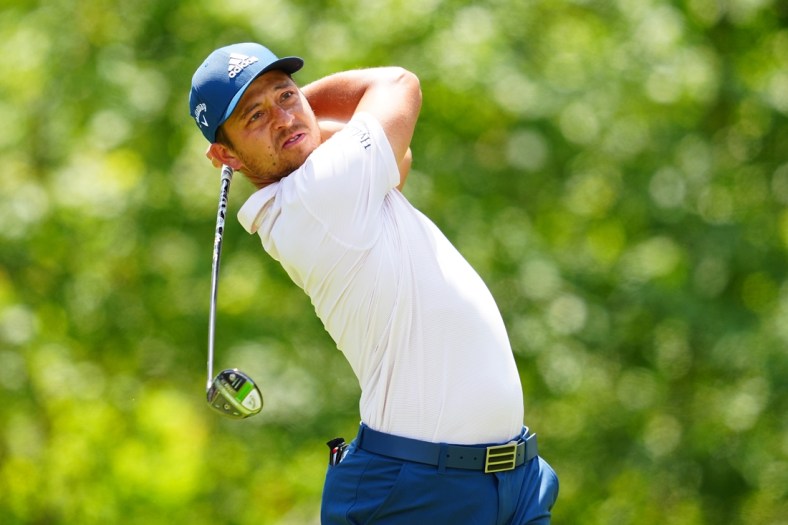 Apr 21, 2022; Avondale, Louisiana, USA; Xander Schauffele plays his shot from the fifth tee during the first round of the Zurich Classic of New Orleans golf tournament. Mandatory Credit: Andrew Wevers-USA TODAY Sports