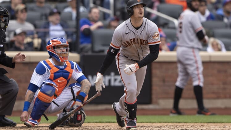 Apr 21, 2022; New York City, New York, USA; San Francisco Giants right fielder Mike Yastrzemski (5) hits a home run against the New York Mets during the eighth inning at Citi Field. Mandatory Credit: Gregory Fisher-USA TODAY Sports