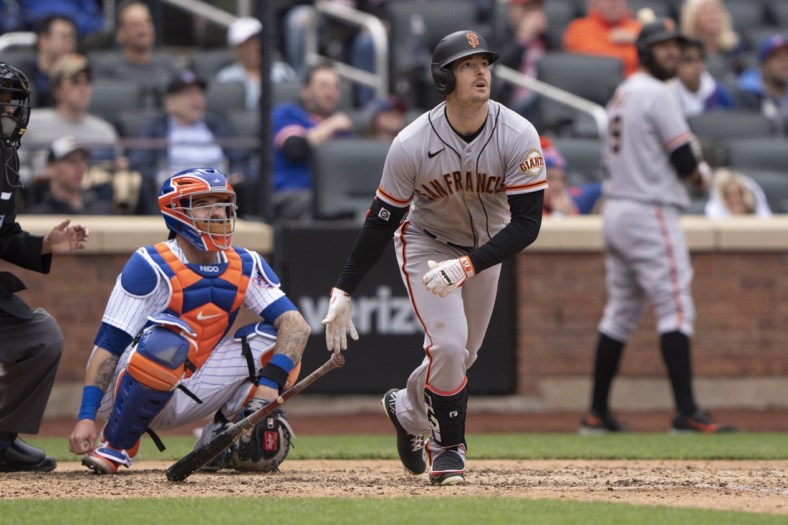 Apr 21, 2022; New York City, New York, USA; San Francisco Giants right fielder Mike Yastrzemski (5) hits a home run against the New York Mets during the eighth inning at Citi Field. Mandatory Credit: Gregory Fisher-USA TODAY Sports