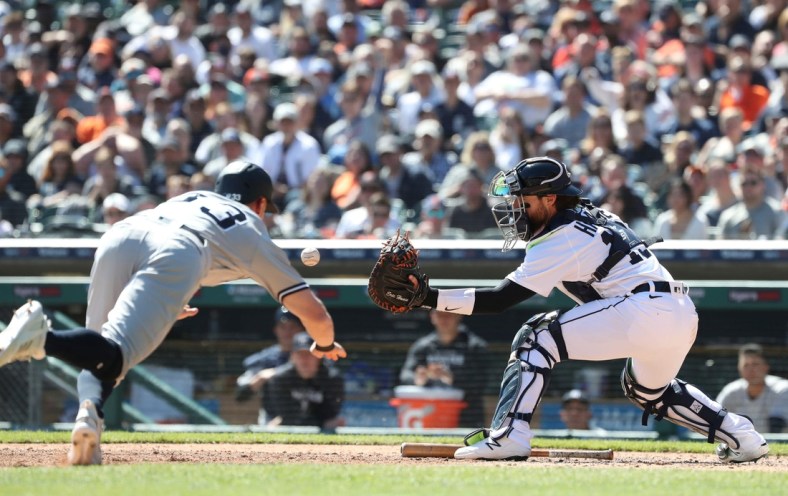 Detroit Tigers catcher Eric Haase gets the force out at home plate on New York Yankees right fielder Tim Locastro during the eighth inning Thursday, April 21, 2022 at Comerica Park.

Tigers Ny3