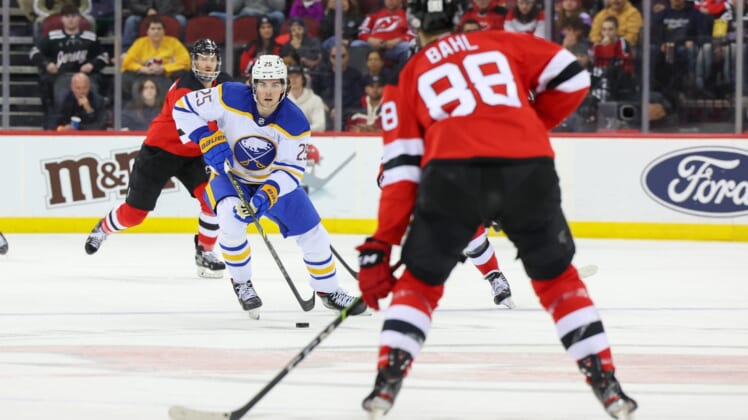 Apr 21, 2022; Newark, New Jersey, USA; Buffalo Sabres defenseman Owen Power (25) skates with the puck against the New Jersey Devils during the first period at Prudential Center. Mandatory Credit: Ed Mulholland-USA TODAY Sports