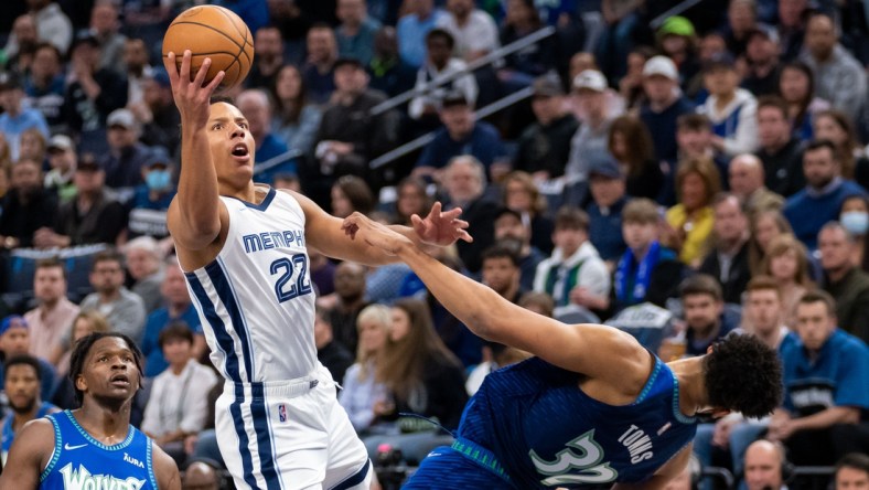 Apr 21, 2022; Minneapolis, Minnesota, USA; Memphis Grizzlies guard Desmond Bane (22) shoots against the Minnesota Timberwolves center Karl-Anthony Towns (32) in the first quarter during game one of the three round for the 2022 NBA playoffs at Target Center. Mandatory Credit: Brad Rempel-USA TODAY Sports