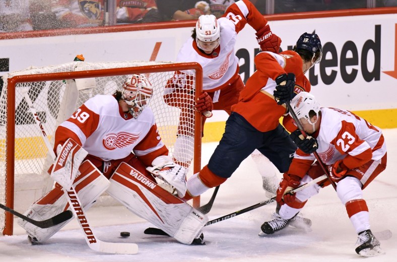 Apr 21, 2022; Sunrise, Florida, USA; Florida Panthers left wing Mason Marchment (17) scores a goal in the first period past Detroit Red Wings goaltender Alex Nedeljkovic (39) as defenseman Moritz Seider (53) and left wing Lucas Raymond (23) defend on the play during the first period at FLA Live Arena. Mandatory Credit: Jim Rassol-USA TODAY Sports