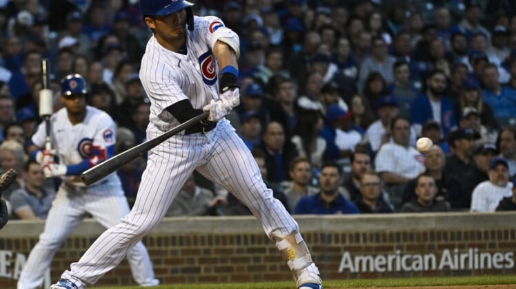 Apr 21, 2022; Chicago, Illinois, USA;  Chicago Cubs right fielder Seiya Suzuki (27) hits an RBI during the second inning against the Pittsburgh Pirates at Wrigley Field. Mandatory Credit: Matt Marton-USA TODAY Sports