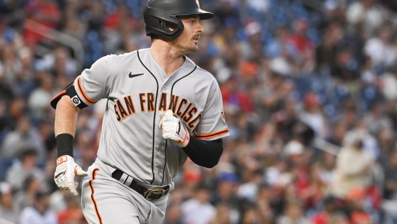 Apr 22, 2022; Washington, District of Columbia, USA;  San Francisco Giants right fielder Mike Yastrzemski (5) singles in the second inning against the Washington Nationals at Nationals Park. Mandatory Credit: Tommy Gilligan-USA TODAY Sports