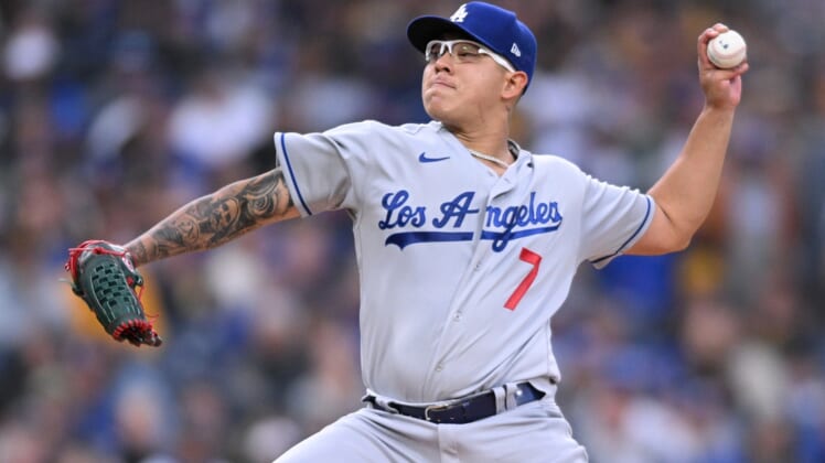 Apr 22, 2022; San Diego, California, USA; Los Angeles Dodgers starting pitcher Julio Urias (7) throws a pitch against the San Diego Padres during the first inning at Petco Park. Mandatory Credit: Orlando Ramirez-USA TODAY Sports