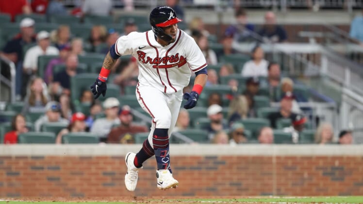 Apr 22, 2022; Cumberland, Georgia, USA; Atlanta Braves left fielder Eddie Rosario (8) runs to first base against the Miami Marlins during the seventh inning at Truist Park. Mandatory Credit: Mackenzie Lynn Miles-USA TODAY Sports