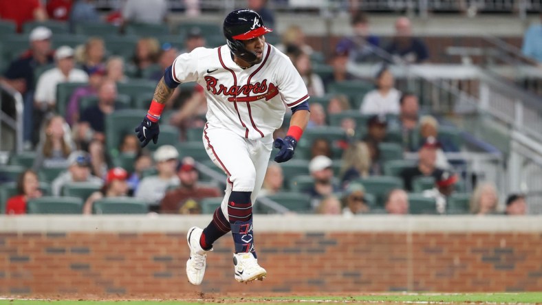 Apr 22, 2022; Cumberland, Georgia, USA; Atlanta Braves left fielder Eddie Rosario (8) runs to first base against the Miami Marlins during the seventh inning at Truist Park. Mandatory Credit: Mackenzie Lynn Miles-USA TODAY Sports