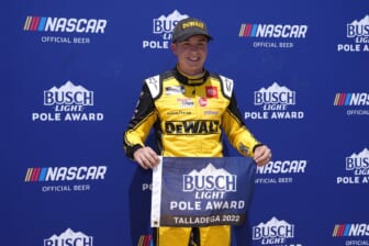Apr 23, 2022; Talladega, Alabama, USA; NASCAR Cup Series driver Christopher Bell (20) poses for a picture after winning the pole for the GEICO 500 at Talladega Superspeedway. Mandatory Credit: Jasen Vinlove-USA TODAY Sports