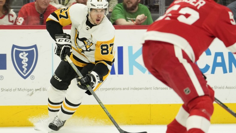 Apr 23, 2022; Detroit, Michigan, USA; Pittsburgh Penguins center Sidney Crosby (87) skates with the puck during the first period against the Detroit Red Wings at Little Caesars Arena. Mandatory Credit: Raj Mehta-USA TODAY Sports