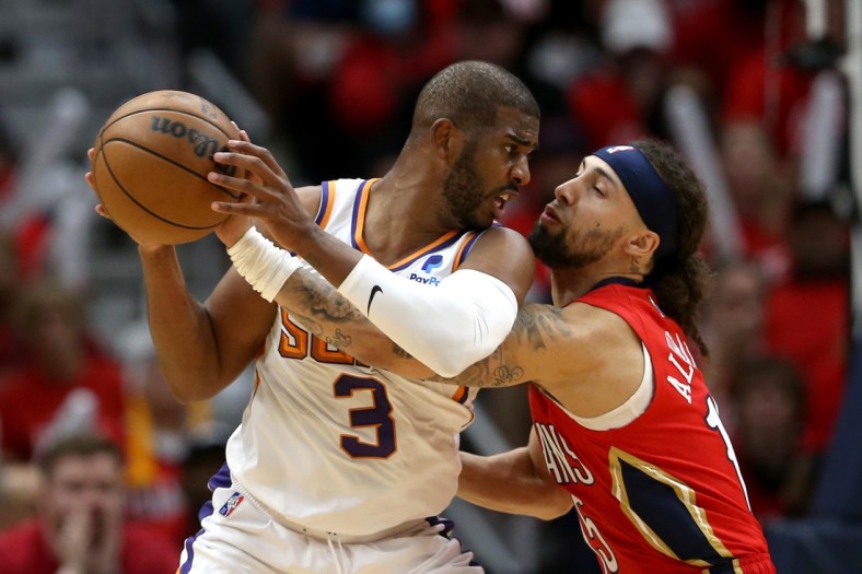 Apr 22, 2022; New Orleans, Louisiana, USA; Phoenix Suns guard Chris Paul (3) is defended by New Orleans Pelicans guard Jose Alvarado (15) in the second quarter of game three of the first round for the 2022 NBA playoffs at the Smoothie King Center. Mandatory Credit: Chuck Cook-USA TODAY Sports