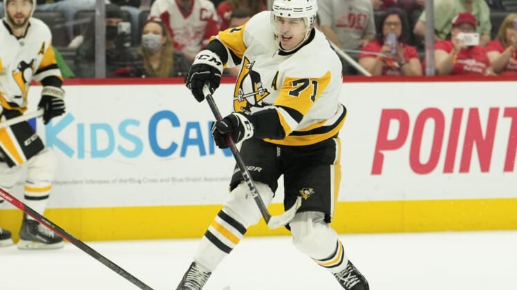 Apr 23, 2022; Detroit, Michigan, USA; Pittsburgh Penguins center Evgeni Malkin (71) takes a shot during the third period against the Detroit Red Wings at Little Caesars Arena. Mandatory Credit: Raj Mehta-USA TODAY Sports