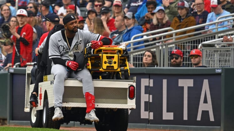 Apr 23, 2022; Minneapolis, Minnesota, USA;  Chicago White Sox left fielder Eloy Jimenez (74) is carted off the field after being injured running to first on a ground ball against the Minnesota Twins during the second inning at Target Field. Mandatory Credit: Nick Wosika-USA TODAY Sports