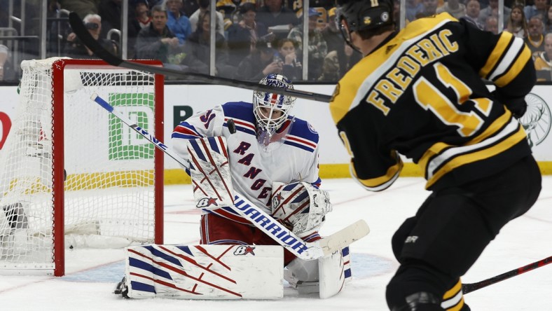 Apr 23, 2022; Boston, Massachusetts, USA; New York Rangers goaltender Igor Shesterkin (31) makes a save on Boston Bruins center Trent Frederic (11) during the second period at TD Garden. Mandatory Credit: Winslow Townson-USA TODAY Sports