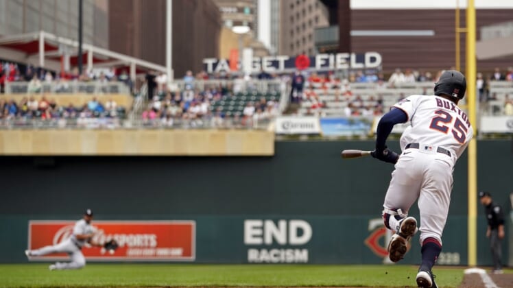 Apr 23, 2022; Minneapolis, Minnesota, USA;  Minnesota Twins center fielder Byron Buxton (25) hits an RBI double off of Chicago White Sox starting pitcher Vince Velasquez (not pictured) during the second inning at Target Field. Mandatory Credit: Nick Wosika-USA TODAY Sports