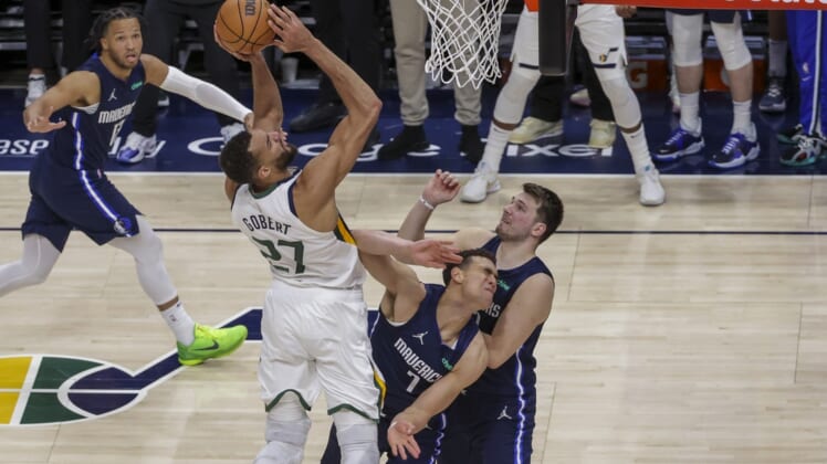 Apr 23, 2022; Salt Lake City, Utah, USA; Utah Jazz center Rudy Gobert (27) shoots the ball over Dallas Mavericks center Dwight Powell (7) during the fourth quarter in game four of the first round for the 2022 NBA playoffs at Vivint Arena. Utah Jazz won 100-00. Mandatory Credit: Chris Nicoll-USA TODAY Sports
