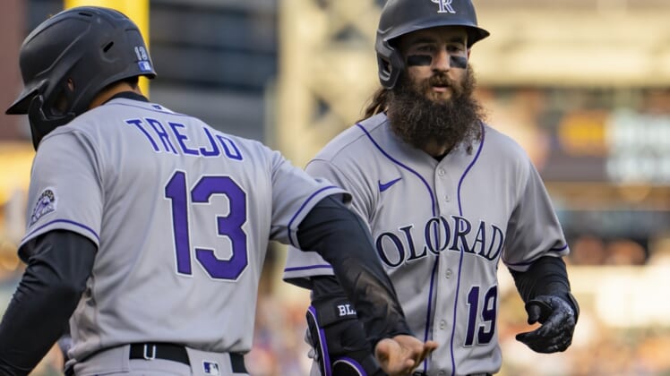 Apr 23, 2022; Detroit, Michigan, USA; Colorado Rockies right fielder Charlie Blackmon (19) celebrates with second baseman Alan Trejo (13) after hitting a two run home run during the third inning against the Detroit Tigers at Comerica Park. Mandatory Credit: Raj Mehta-USA TODAY Sports