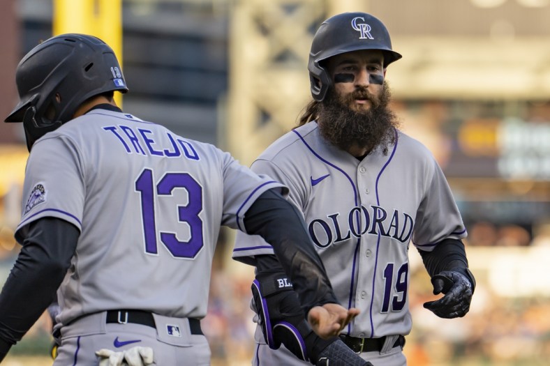 Apr 23, 2022; Detroit, Michigan, USA; Colorado Rockies right fielder Charlie Blackmon (19) celebrates with second baseman Alan Trejo (13) after hitting a two run home run during the third inning against the Detroit Tigers at Comerica Park. Mandatory Credit: Raj Mehta-USA TODAY Sports