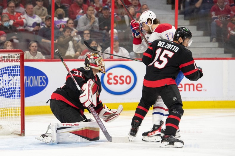 Apr 23, 2022; Ottawa, Ontario, CAN; Ottawa Senators goalie Anton Forsberg (31) makes a save in front of Montreal Canadiens right wing Josh Anderson (17) in the first period at the Canadian Tire Centre. Mandatory Credit: Marc DesRosiers-USA TODAY Sports