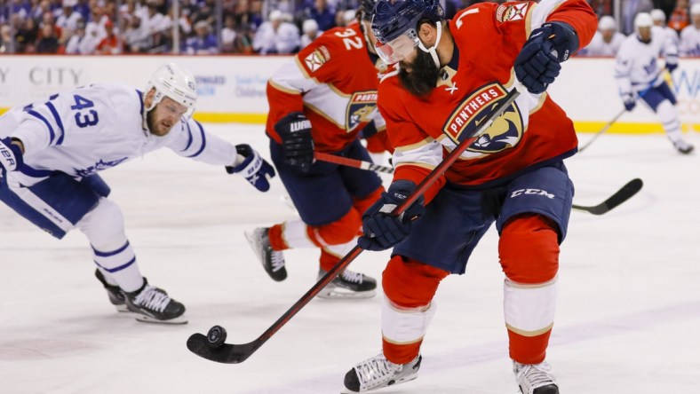 Apr 23, 2022; Sunrise, Florida, USA; Florida Panthers defenseman Radko Gudas (7) controls the puck against the Toronto Maple Leafs during the first period at FLA Live Arena. Mandatory Credit: Sam Navarro-USA TODAY Sports