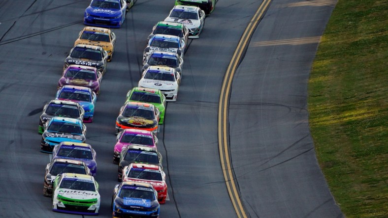 Apr 23, 2022; Talladega, Alabama, USA; NASCAR Xfinity Series driver Justin Allgaier (7) and NASCAR Xfinity Series driver AJ Allmendinger (16) lead the field during the Ag-Pro 300 at Talladega Superspeedway. Mandatory Credit: John David Mercer-USA TODAY Sports