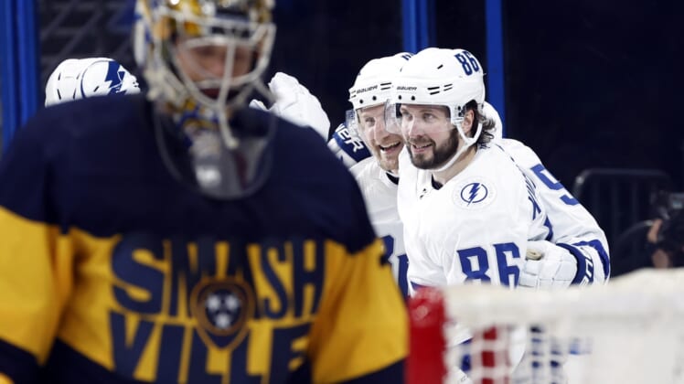 Apr 23, 2022; Tampa, Florida, USA; Tampa Bay Lightning center Steven Stamkos (91) is congratulated by right wing Nikita Kucherov (86) as he scores a goal against the Nashville Predators during the second period at Amalie Arena. Mandatory Credit: Kim Klement-USA TODAY Sports