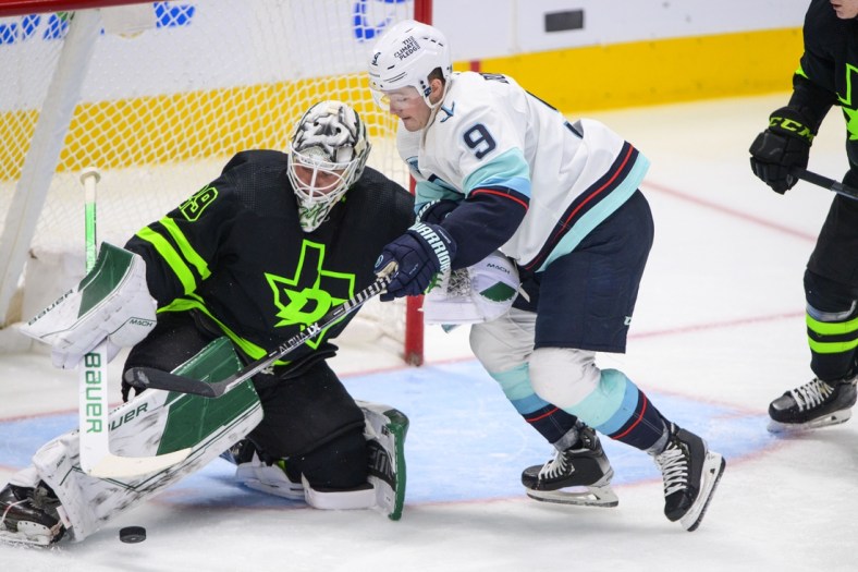 Apr 23, 2022; Dallas, Texas, USA; Dallas Stars goaltender Jake Oettinger (29) makes a pad save on a breakaway shot by Seattle Kraken center Ryan Donato (9) during the second period at the American Airlines Center. Mandatory Credit: Jerome Miron-USA TODAY Sports