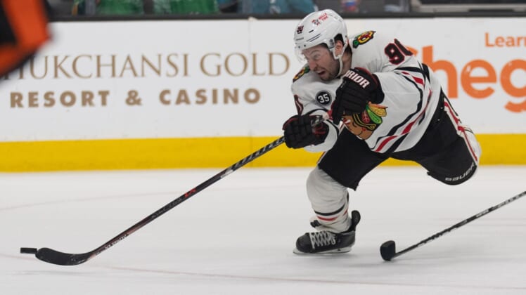 Apr 23, 2022; San Jose, California, USA;  Chicago Blackhawks center Tyler Johnson (90) attempts to control the puck during the third period against the San Jose Sharks at SAP Center at San Jose. Mandatory Credit: Stan Szeto-USA TODAY Sports
