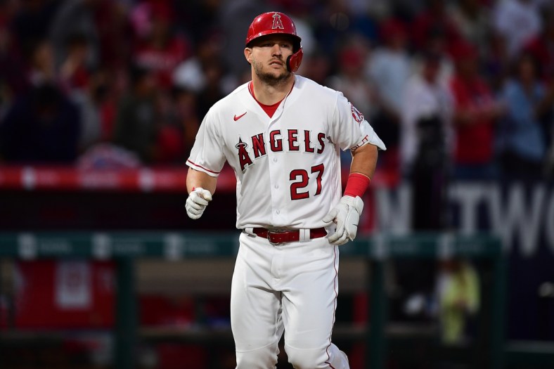 Apr 23, 2022; Anaheim, California, USA; Los Angeles Angels center fielder Mike Trout (27) reacts after hitting a solo home run against the Baltimore Orioles during the fifth inning at Angel Stadium. Mandatory Credit: Gary A. Vasquez-USA TODAY Sports
