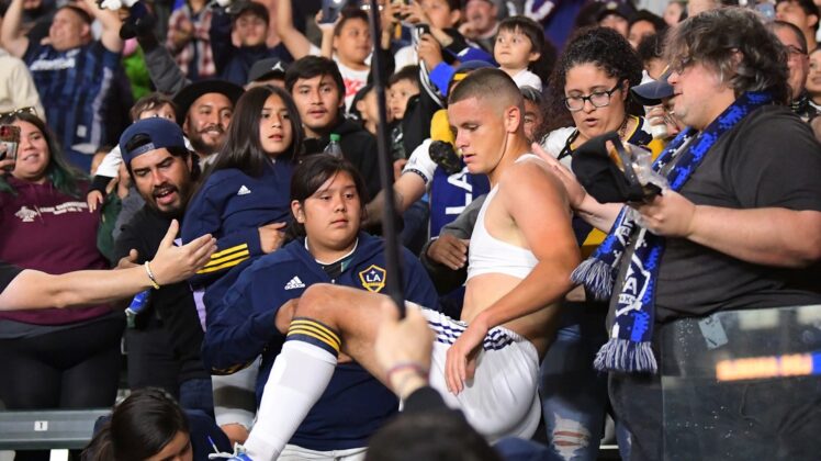 Apr 23, 2022; Carson, California, USA; Los Angeles Galaxy forward Dejan Joveljic (99) tears off his jersey and runs into the stands to celebrate after scoring a goal in the second half against the Nashville SC at Dignity Health Sports Park. Mandatory Credit: Jayne Kamin-Oncea-USA TODAY Sports