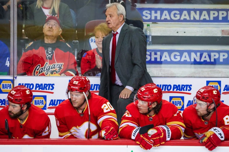 Apr 23, 2022; Calgary, Alberta, CAN; Calgary Flames head coach Darryl Sutter on his bench against the Vancouver Canucks during the first period at Scotiabank Saddledome. Mandatory Credit: Sergei Belski-USA TODAY Sports