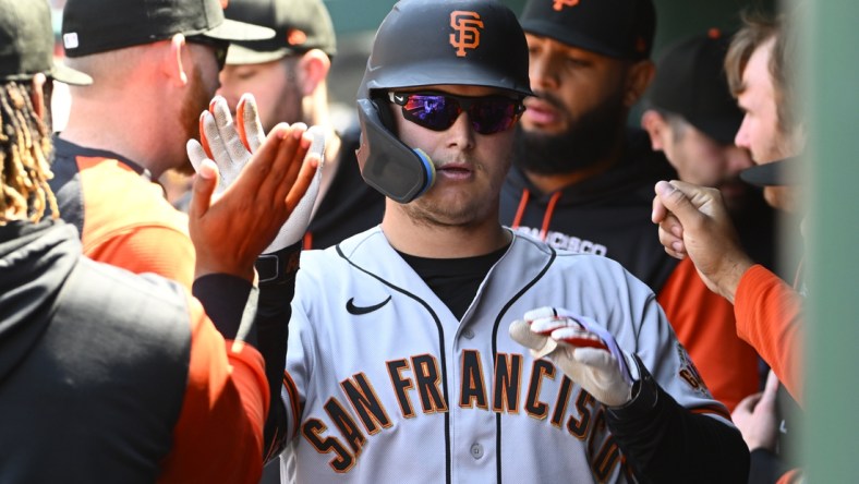 Apr 24, 2022; Washington, District of Columbia, USA; San Francisco Giants right fielder Joc Pederson (23) is congratulated by teammates after hitting an RBI sacrifice fly against the Washington Nationals during the second inning at Nationals Park. Mandatory Credit: Brad Mills-USA TODAY Sports