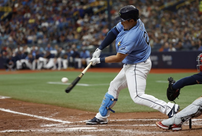 Apr 24, 2022; St. Petersburg, Florida, USA; Tampa Bay Rays first baseman Ji-Man Choi (26) hits a 2 RBI double during the fifth inning against the Boston Red Sox at Tropicana Field. Mandatory Credit: Kim Klement-USA TODAY Sports