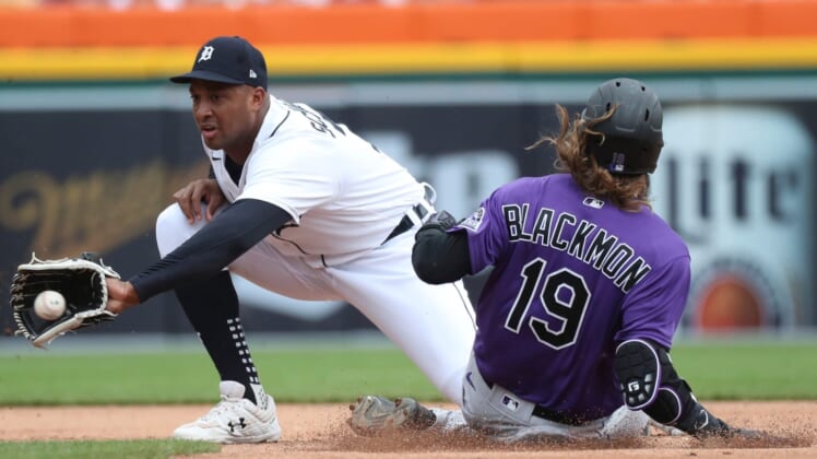 Colorado Rockies right fielder Charlie Blackmon (19) slides safely into second base ahead of the tag by Tigers second baseman Jonathan Schoop  (7) during third-inning action on Sunday, April 24, 2022, at Comerica Park in Detroit.Tigers Col3