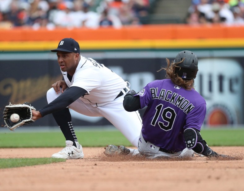 Colorado Rockies right fielder Charlie Blackmon (19) slides safely into second base ahead of the tag by Tigers second baseman Jonathan Schoop  (7) during third-inning action on Sunday, April 24, 2022, at Comerica Park in Detroit.

Tigers Col3