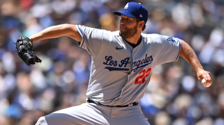 Apr 24, 2022; San Diego, California, USA; Los Angeles Dodgers starting pitcher Clayton Kershaw (22) throws a pitch against the San Diego Padres during the first inning at Petco Park. Mandatory Credit: Orlando Ramirez-USA TODAY Sports