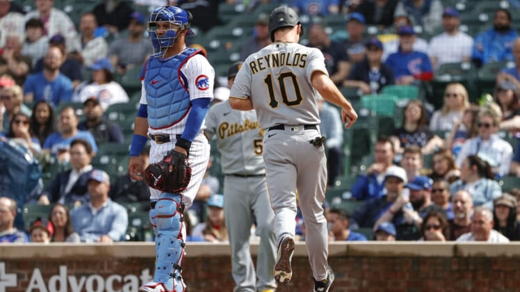 Apr 24, 2022; Chicago, Illinois, USA; Pittsburgh Pirates left fielder Bryan Reynolds (10) scores against the Chicago Cubs during the third inning at Wrigley Field. Mandatory Credit: Kamil Krzaczynski-USA TODAY Sports