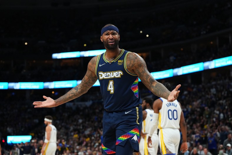 Apr 24, 2022; Denver, Colorado, USA; Denver Nuggets center DeMarcus Cousins (4) reacts to a foul in the second quarter against the Golden State Warriors of the first round for the 2022 NBA playoffs at Ball Arena. Mandatory Credit: Ron Chenoy-USA TODAY Sports
